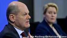German Chancellor Olaf Scholz and Berlin's Mayor Franziska Giffey, right, address a press conference following a meeting with the heads of government of Germany's federal states at the Chancellery in Berlin on Friday Jan. 7, 2022. (John MacDougall/Pool via AP)
