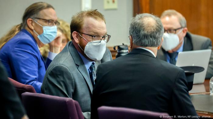 Travis McMichael speaks with his attorney during his sentencing hearing for murdering Ahmaud Arbery in Brunswick, Georgia