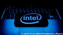 The Intel logo against a blue lit keyboard