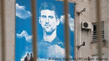 A billboard depicting Serbian tennis player Novak Djokovic, on a building in Belgrade, Serbia, Thursday, Jan. 6, 2022. The Australian government has denied No. 1-ranked Novak Djokovic entry to defend his title in the year's first tennis major and canceled his visa because he failed to meet the requirements for an exemption to the country's COVID-19 vaccination rules. (AP Photo/Darko Vojinovic)