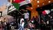 People chant slogans in Khartoum as several wave the Sudanese flag People chant slogans in Khartoum as several wave the Sudanese flag