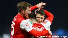 BERLIN, GERMANY - JANUARY 09: Jan Thielmann of 1. FC Koeln celebrates with teammates after scoring their side's third goal during the Bundesliga match between Hertha BSC and 1. FC Köln at Olympiastadion on January 09, 2022 in Berlin, Germany. (Photo by Martin Rose/Getty Images)
