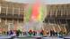 The opening ceremony of the Africa Cup of Nations featuring performers and a cloud of colored smoke in a stadium The opening ceremony of the Africa Cup of Nations featuring performers and a cloud of colored smoke in a stadium