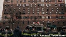 NEW YORK, NY - JANUARY 09: Emergency first responders remain at the scene after an intense fire at a 19-story residential building that erupted in the morning on January 9, 2022 in the Bronx borough of New York City. Reports indicate over 50 people were injured. Scott Heins/Getty Images/AFP
== FOR NEWSPAPERS, INTERNET, TELCOS & TELEVISION USE ONLY ==