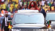 Cameroon's President Paul Biya (C-L) and First Lady of Cameroon Chantal Biya (C-R) wave at the crowd during the opening ceremony of the Africa Cup of Nations (CAN) 2021 football tournament at Stade d'Olembé in Yaounde on January 9, 2022. (Photo by Kenzo Tribouillard / AFP)