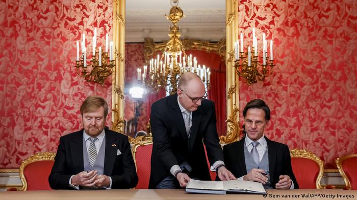 Willem-Alexander and Prime Minister Mark Rutte sign the Royal Decrees, as part of the inauguration of the new Mark Rutte's IV cabinet