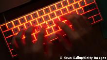 BERLIN, GERMANY - JANUARY 25: In this photo illustration a young man types on an illuminated computer keyboard typically favored by computer coders on January 25, 2021 in Berlin, Germany. 2020 saw a sharp rise in global cybercrime that was in part driven by the jump in online retailing that ensued during national lockdowns as governments sought to rein in the coronavirus pandemic. (Photo by Sean Gallup/Getty Images)