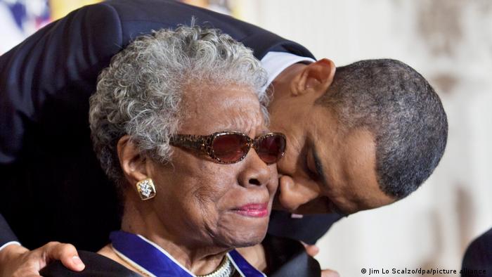 US President Barack Obama in 2010 is kissling poet and activist Maya Angelou on the cheek.