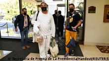 Cuban journalists Hector Valdez and Esteban Rodriguez, both reporters with independent news website ADN Cuba, arrive at a hotel after being transported from El Salvador International Airport upon their arrival to El Salvador as they were expelled from Cuba and denied entry to Nicaragua, in San Salvador, El Salvador, January 5, 2022. Secretaria de Prensa de La Presidencia/Handout via REUTERS ATTENTION EDITORS - THIS IMAGE WAS PROVIDED BY A THIRD PARTY. NO RESALES. NO ARCHIVES