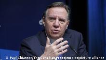 THE CANADIAN PRESS 2022-01-11. Quebec Premier Francois Legault responds to a question during a news conference in Montreal, Tuesday, Jan. 11, 2022. THE CANADIAN PRESS/Paul Chiasson URN:64688409