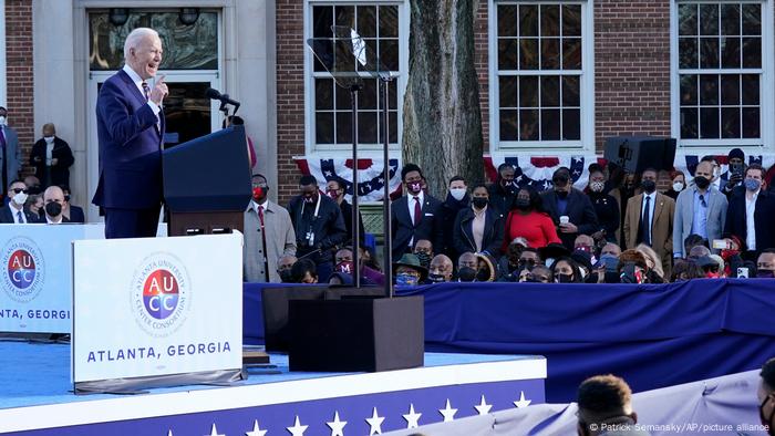 Biden speaking at a stage in Atlanta, Georgia