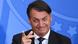 Foto de Bolsonaro com sorriso malicioso. Ele faz gesto com as mãos. Foto de Bolsonaro com sorriso malicioso. Ele faz gesto com as mãos.