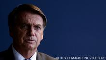 FILE PHOTO: Brazil's President Jair Bolsonaro speaks during a ceremony of a public security program at the Justice Ministry headquarter in Brasilia, Brazil, November 25, 2021. REUTERS/Ueslei Marcelino/File Photo