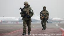 ALMATY, KAZAKHSTAN - JANUARY 13, 2022: Russian servicemen with the CSTO peacekeeping forces walk along at Almaty International Airport. The Collective Security Treaty Organisation proceeds with a phased withdrawal of its peacekeeping contingent on January 13 upon successfully accomplishing an objective to help Kazakhstan restore and keep order in the protest-hit areas of the country. A rise in fuel prices sparked protests in the towns of Zhanaozen and Aktau in western Kazakhstan on January 2 and spread rapidly across the country. On January 5, President Tokayev dismissed the cabinet and declared a two-week state of emergency in the Mangistau and Almaty regions as well as in the cities of Almaty and Nur-Sultan. Gavriil Grigorov/TASS