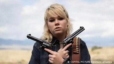 Hannah Gutierrez-Reed, armorer for the film 'Rust,' holding guns