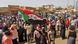A Sudanese demonstrator waves a national flag during a protest in Khartoum against the October 2021 military coup A Sudanese demonstrator waves a national flag during a protest in Khartoum against the October 2021 military coup
