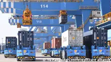 QINGDAO, CHINA - JANUARY 14, 2022 - Cranes are used to lift foreign trade containers at qianwan Port in Qingdao, East China's Shandong Province, Jan. 14, 2022. In 2021, China's import and export volume exceeded us $6 trillion for the first time.