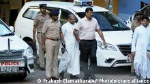 FILE - Bishop of the Indian city of Jalandhar, Franco Mulakkal, center, leaves after being questioned by police in Kochi, India, Sept. 19, 2018. An Indian court on Friday, Jan. 14, 2021, acquitted the Roman Catholic bishop of charges of raping a nun in her rural convent, a case that became a major issue of allegations of sexual harassment in the church. (AP Photo/Prakash Elamakkara, File)