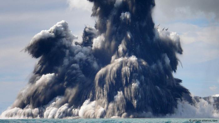A volcano explodes in the sea