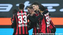 MOENCHENGLADBACH, GERMANY - JANUARY 15: Robert Andrich of Bayer 04 Leverkusen celebrates with Patrik Schick and teammates after scoring their side's first goal during the Bundesliga match between Borussia Mönchengladbach and Bayer 04 Leverkusen at Borussia-Park on January 15, 2022 in Moenchengladbach, Germany. (Photo by Lukas Schulze/Getty Images)