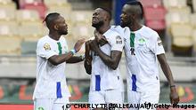 Sierra Leone's forward Musa Noah Kamara (C) celebrates with Sierra Leone's forward Kei Kamara (R) and Sierra Leone's forward Mohamed Buya Turay (L) after scoring his team's first goal during the Group E Africa Cup of Nations (CAN) 2021 football match between Ivory Coast and Sierra Leone at Stade de Japoma in Douala on January 16, 2022. (Photo by CHARLY TRIBALLEAU / AFP) (Photo by CHARLY TRIBALLEAU/AFP via Getty Images)