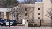 Police stand in front of the Congregation Beth Israel synagogue, Sunday, Jan. 16, 2022, in Colleyville, Texas. A man held hostages for more than 10 hours Saturday inside the temple. The hostages were able to escape and the hostage taker was killed. FBI Special Agent in Charge Matt DeSarno said a team would investigate the shooting incident. (AP Photo/Brandon Wade)