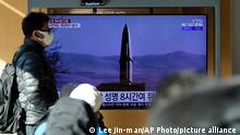 People watch a TV screen showing a news program reporting about North Korea's missile launch with a file image, at a train station in Seoul, South Korea, Monday, Jan. 17, 2022. North Korea on Monday fired two suspected ballistic missiles into the sea in its fourth weapons launch this month, South Korea's military said, with the apparent goal of demonstrating its military might amid paused diplomacy with the United States and pandemic border closures. (AP Photo/Lee Jin-man)