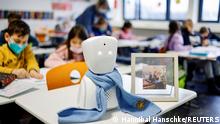 A seven-year-old schoolboy Joshua attends his school lesson via a robot avatar, placed in his classroom, in Berlin, Germany January 13, 2022. Picture taken January 13, 2022. REUTERS/Hannibal Hanschke