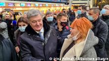 Petro Poroshenko stands at an airport in Poland ahead of his return to Ukraine