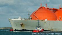 LNG or liquid natural gas tanker entering Rotterdam harbour, to dock at a the new LNG terminal, 07.03.2016, Copyright: xMischaxKeijserx sailing,orange color,finance,support,netherlands,outdoors,sea,day,harbor,business,energy,gas,industry,shipping industry,water,nobody,transport,tugboat,cloudscape,tug,vessel,rotterdam,entering,tanker,liquefied natural gas,March 2016 Release,Entering,Energy,Support,No People,The Netherlands,Western Netherlands,South Holland,Rotterdam,Symbol,Orthographic Symbol,Numeral,District,Harbour,Nautical Vessel,Boat,Tugboat,Ship ,Tanker,Gas,Sky,Cloud,Cloudscape,Flowing Water,Ocean,Outdoors,Day,Business,Finance,Industry,Freight Transportation,Shipping,Sailing Ref:IS09AW3PP