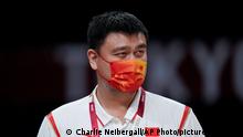 China's Yao Ming watches during a women's basketball preliminary round game between China and Puerto Rico at the 2020 Summer Olympics in Saitama, Japan, Tuesday, July 27, 2021. (AP Photo/Charlie Neibergall)