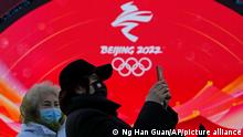Staff members attend a rehearsal for a victory ceremony at the Beijing Medals Plaza of the Winter Olympics in Beijing