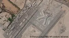 In a satellite photo by Planet Labs PBC, Abu Dhabi International Airport is seen Dec. 8, 2021. A suspected drone attack by Yemen's Houthi rebels targeting a key oil facility in Abu Dhabi killed three people and sparked a separate fire at Abu Dhabi's international airport on Monday, Jan. 17, 2022, police said. (Planet Labs PBC via AP)