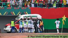 Burkina Faso players celebrate with their fans during the Group A Africa Cup of Nations (CAN) 2021 football match between Burkina Faso and Ethiopia at Stade de Kouekong in Bafoussam on January 17, 2022. (Photo by Pius Utomi EKPEI / AFP) (Photo by PIUS UTOMI EKPEI/AFP via Getty Images)