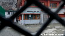 The closed Kashmir Press Club building is pictured through a gate in Srinagar on January 18, 2022. (Photo by TAUSEEF MUSTAFA / AFP)