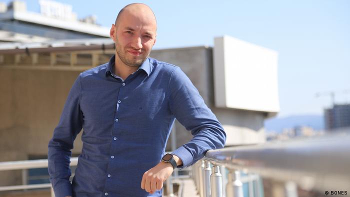 Bulgarian opinion pollster Dimitar Ganev in a blue shirt on a rooftop