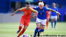 MONTPELLIER, FRANCE - JUNE 25: Ying Li of China is challenged by Elena Linari of Italy during the 2019 FIFA Women's World Cup France Round Of 16 match between Italy and China at Stade de la Mosson on June 25, 2019 in Montpellier, France. (Photo by Laurence Griffiths/Getty Images)