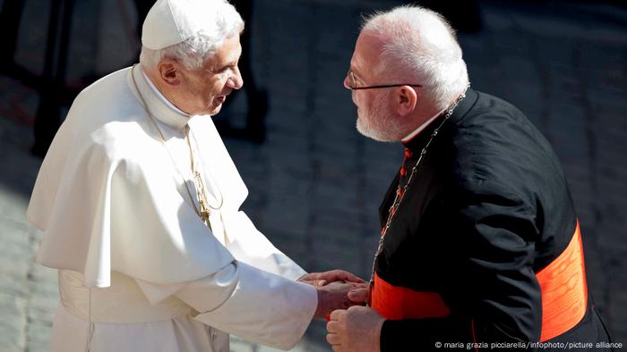 Pope Benedict shakes hands with German Cardinal Reinhard Marx in 2011