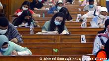 (210610) -- GIZA, June 10, 2021 (Xinhua) -- Students wearing face masks maintain social distancing while taking the final exams at Cairo University in Giza, Egypt, June 10, 2021. Universities across Egypt are holding final exams with measures against COVID-19 in place. (Xinhua/Ahmed Gomaa)