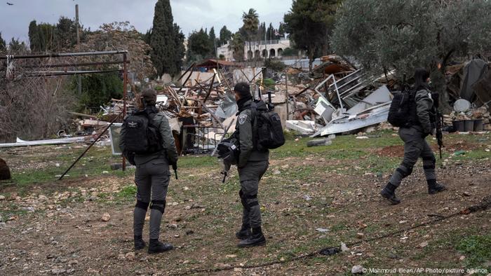Israeli border police officers stand next to the ruins of a Palestinian house demolished by the Jerusalem municipality, in the flashpoint east Jerusalem neighborhood of Sheikh Jarrah Israeli border police officers stand next to the ruins of a Palestinian house demolished by the Jerusalem municipality, in the flashpoint east Jerusalem neighborhood of Sheikh Jarrah