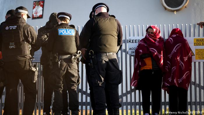 Migrants being apprehended by British police