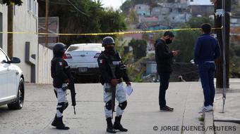 Armed guards at crime scene after murder of Martinez Esquivel