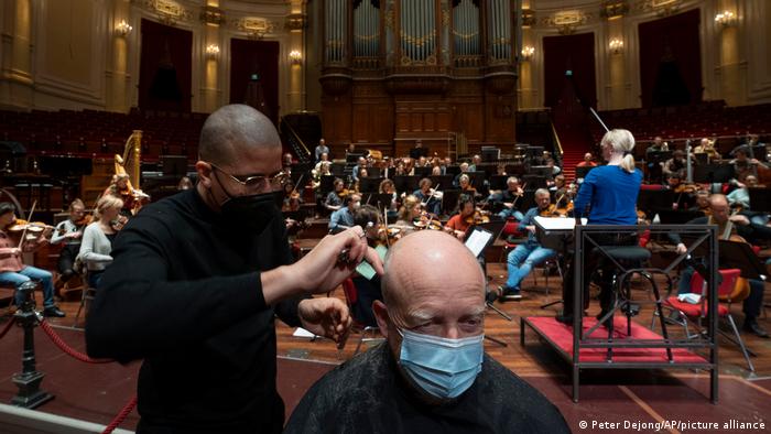 A man gets a haircut during a rehearsal at the Concertgebouw in Amsterdam