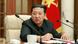 Kim Jong Un at a politburo meeting; a Worker's Party flag is seen in the background Kim Jong Un at a politburo meeting; a Worker's Party flag is seen in the background