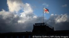 A flag of the International Committee of the Red Cross (ICRC) flutters in the wind on the top of the humanitarian organization's headquarters in Geneva, on September 29, 2021. (Photo by Fabrice COFFRINI / AFP) (Photo by FABRICE COFFRINI/AFP via Getty Images)