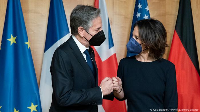 Secretary of State Antony Blinken, left, fist bumps German Foreign Minister Annalena Baerbock, before their meeting at the Ministry of Foreign Affairs, Thursday, Jan. 20, 2022, in Berlin, Germany.