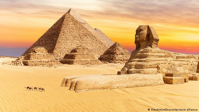 The Sphinx and the Pyramids of Giza at sunset