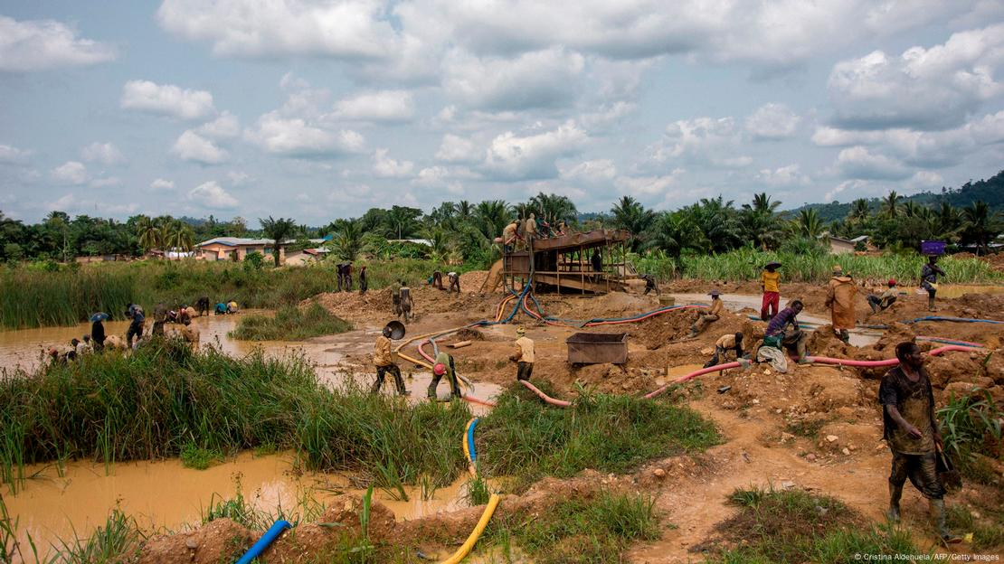 Men working on the surface of a gold mine