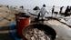 Trabajadores con trajes especiales retiran el vertido petrolero que afecta playas de la provincia peruana de El Callao. Trabajadores con trajes especiales retiran el vertido petrolero que afecta playas de la provincia peruana de El Callao.