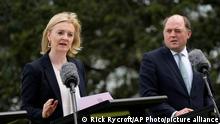 British Foreign Secretary Liz Truss, left, and British Defence Secretary Ben Wallace participate in a press conference with their Australian counterparts following Australia-United Kingdom Ministerial Consultations (AUKMIN) talks at Admiralty House, in Sydney, Friday, Jan. 21, 2022. (AP Photo/Rick Rycroft)